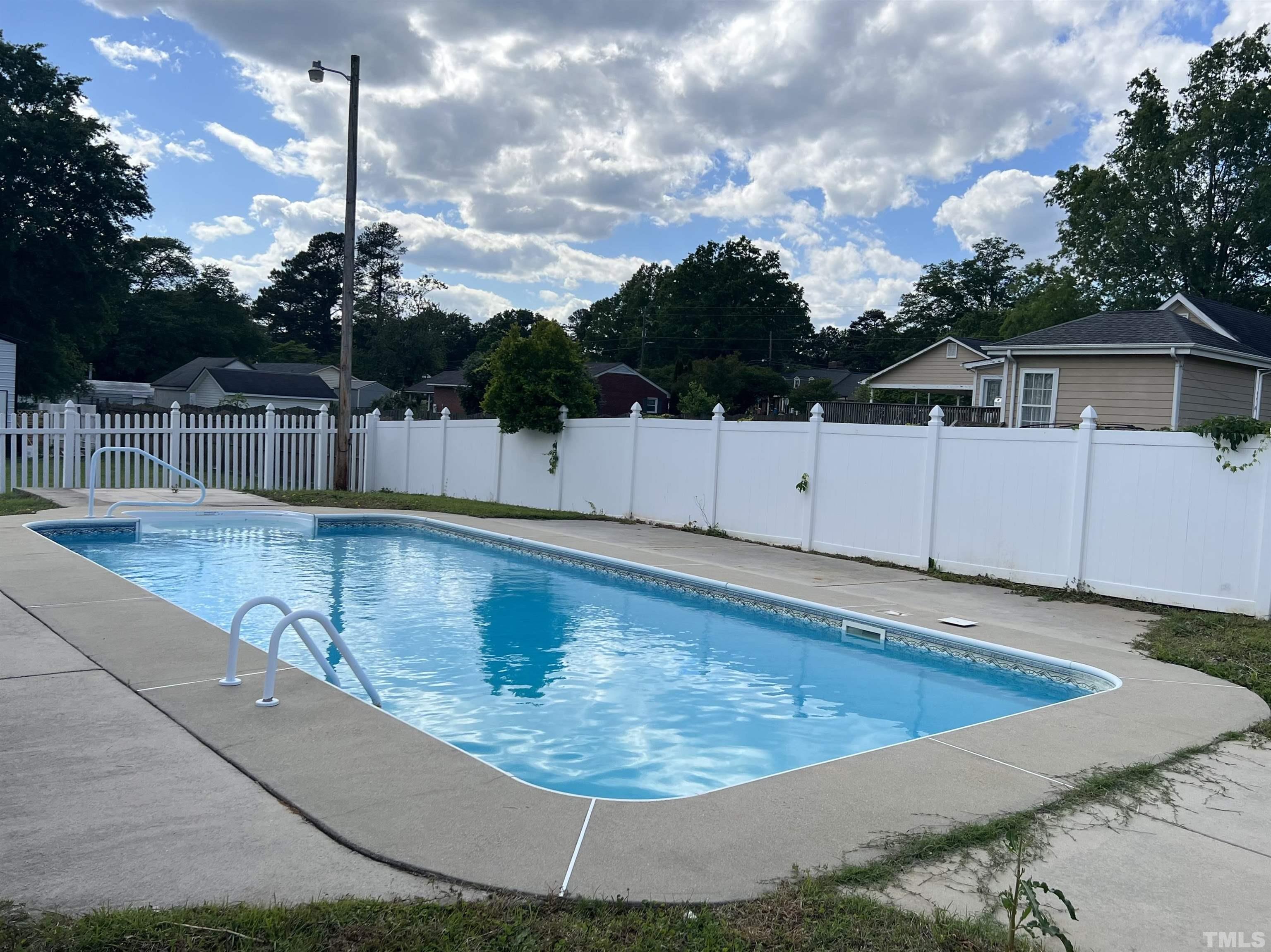 104 Marion Drive Erwin, NC 28339 - Photo 26 of 28 a view of a swimming pool with a yard