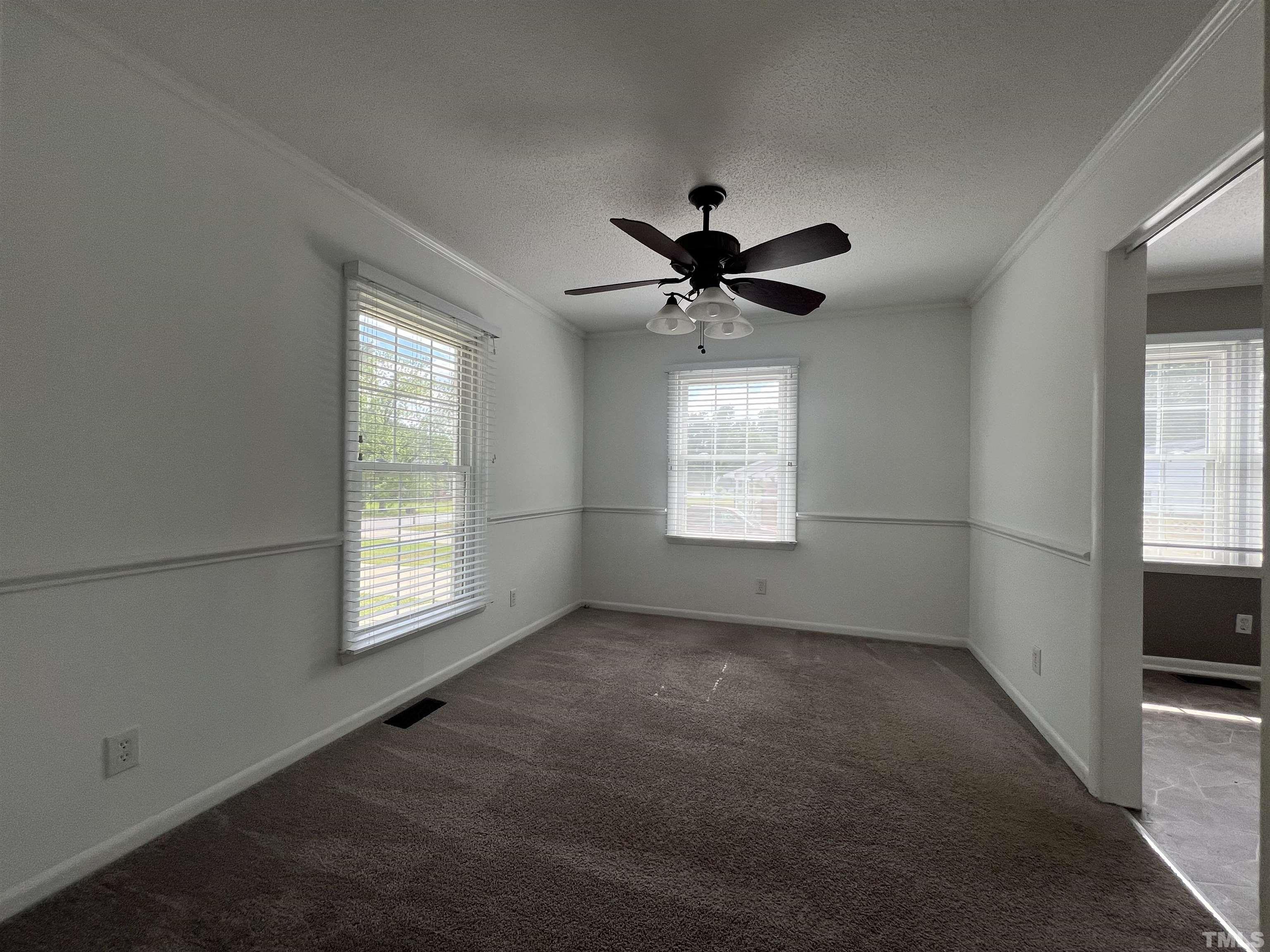 104 Marion Drive Erwin, NC 28339 - Photo 10 of 28 a view of a livingroom with a ceiling fan and window