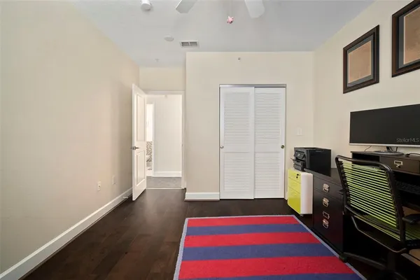 a bedroom with a bed and a dresser
