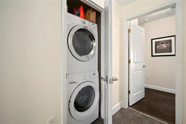 a bedroom with a large bed and a large window