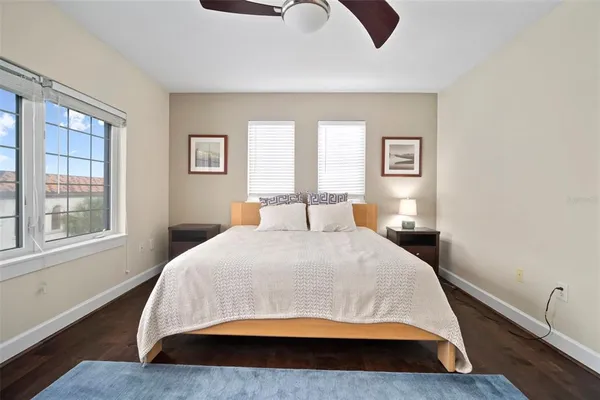 a bathroom with a granite countertop sink a mirror and shower