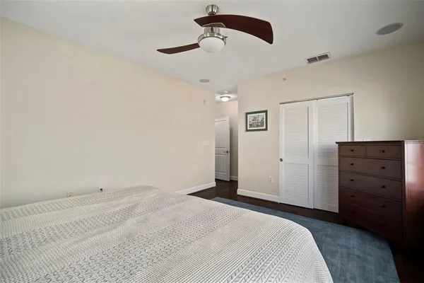 a kitchen with granite countertop stainless steel appliances a refrigerator stove top oven and sink