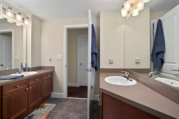 a kitchen with a sink granite counter tops and a window