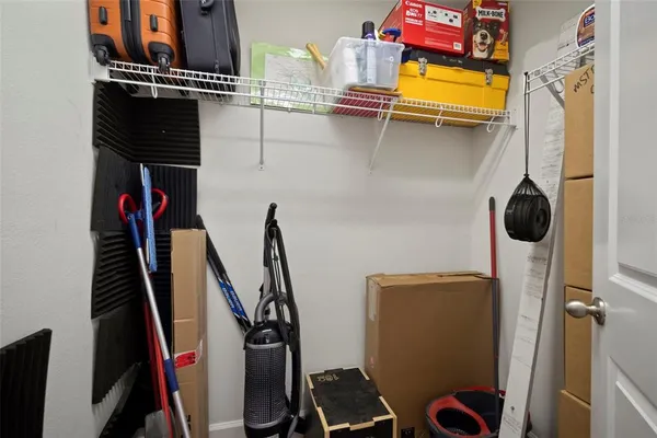 a bathroom with a granite countertop double vanity sink and a mirror