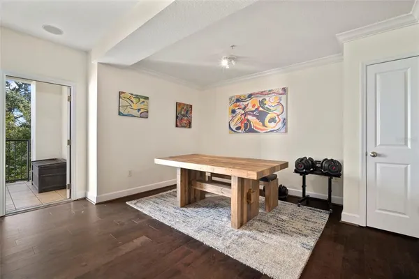 a view of a dining room with furniture and chandelier