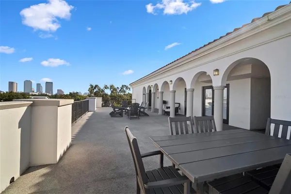 a front view of a house with a yard table and chairs
