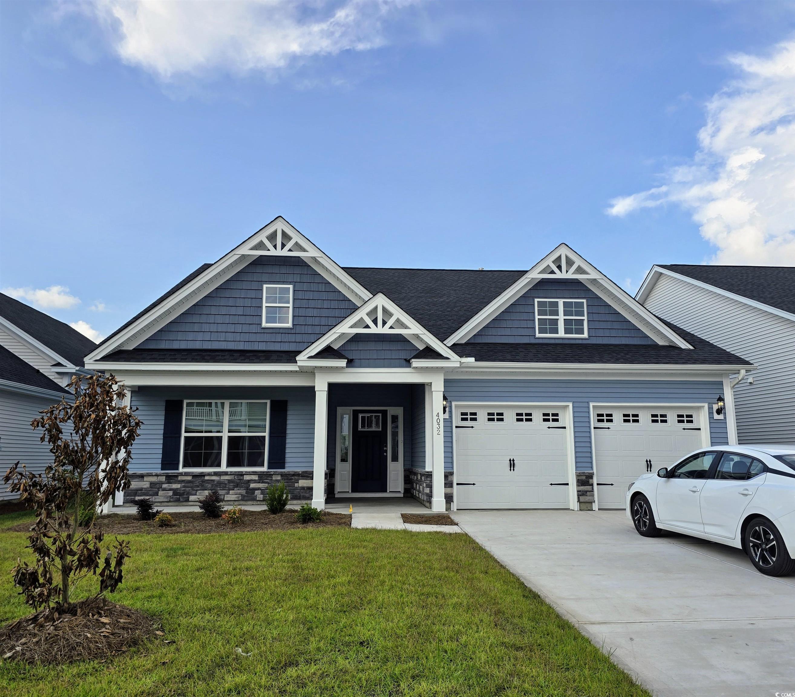 4032 Bucolic Loop Myrtle Beach, SC 29588 - Photo 1 of 36 Craftsman-style house featuring stone siding, driv