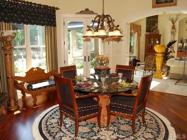 6024 Over Hadden Court Raleigh, NC 27614 - Photo 4 of 12 a view of a dining room with furniture window and wooden floor
