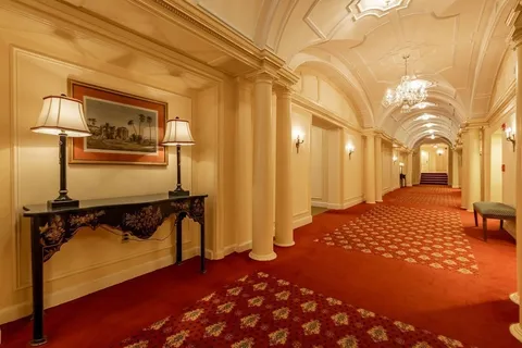 a view of a porch with a table and chairs