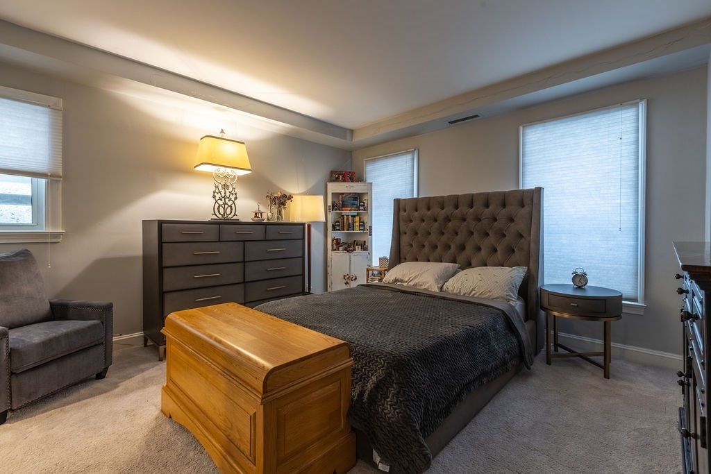 416 Commonwealth Avenue, Unit 212 Boston, MA 02215 - Photo 7 of 19 a bedroom with a bed and a couch