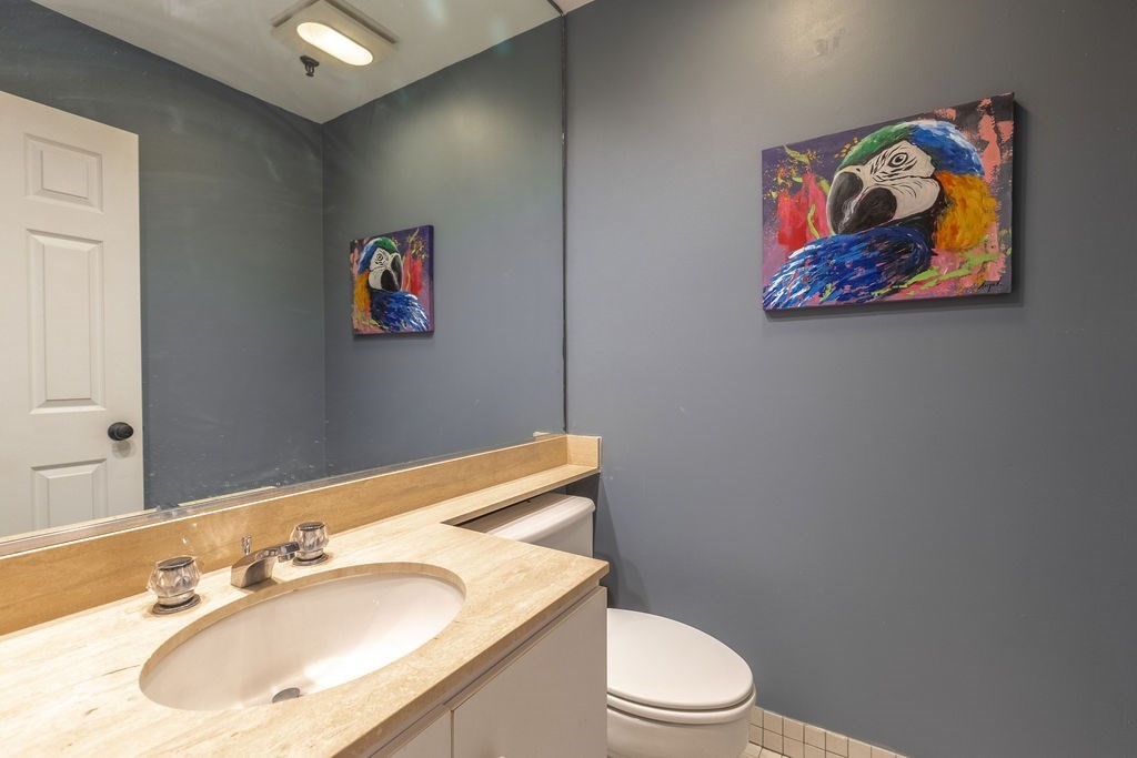 416 Commonwealth Avenue, Unit 212 Boston, MA 02215 - Photo 9 of 19 a bathroom with a sink mirror and toilet