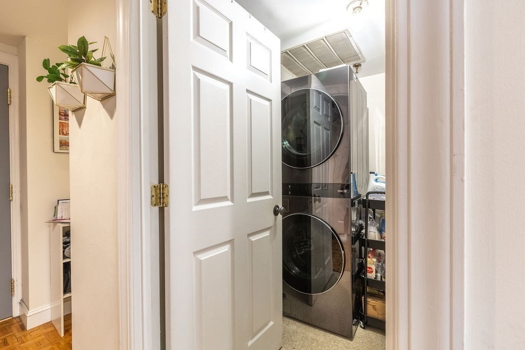 416 Commonwealth Avenue, Unit 212 Boston, MA 02215 - Photo 10 of 19 a utility room with wooden floor washer and dryer