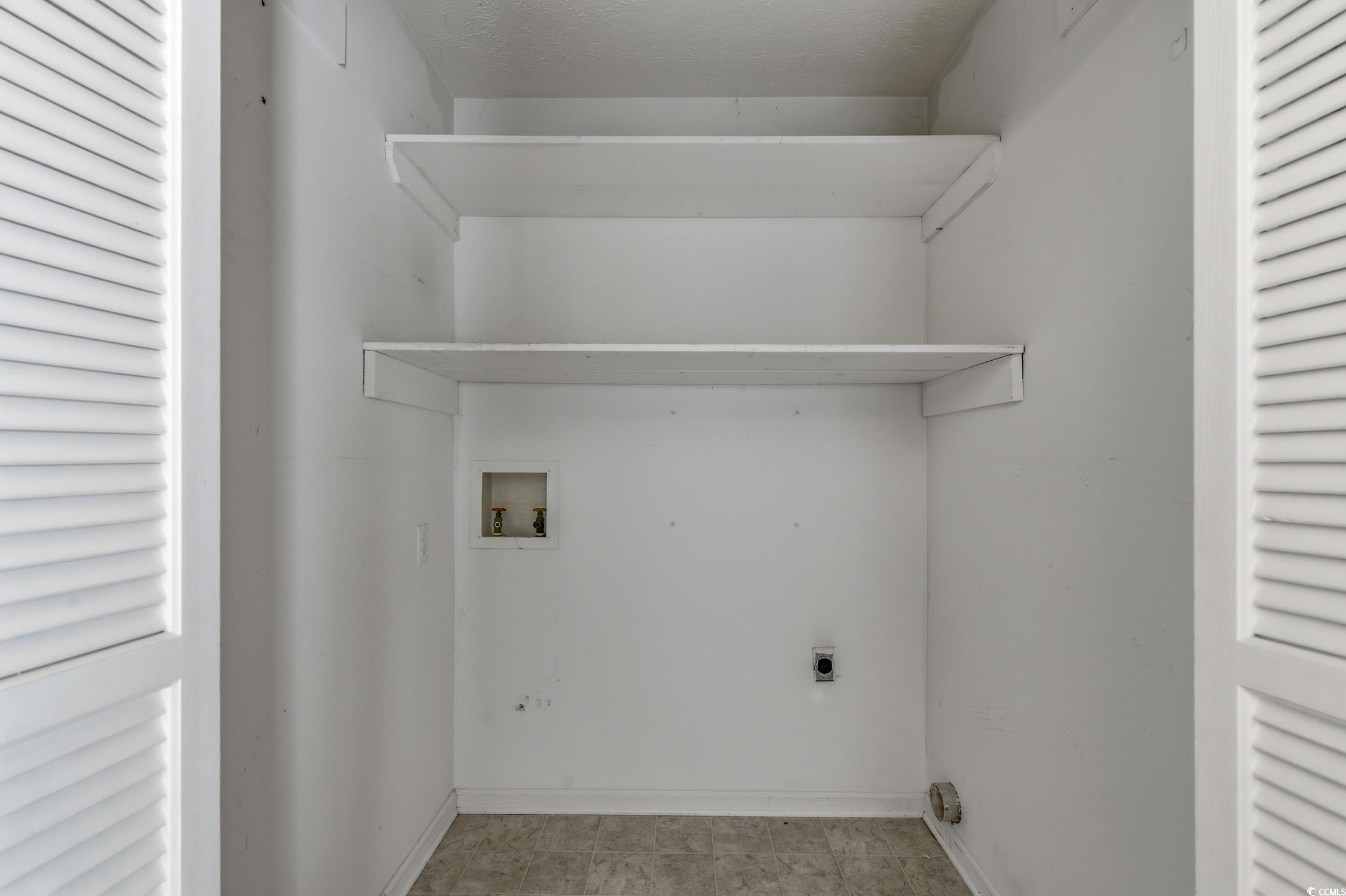 1605 Sessions Street Conway, SC 29526 - Photo 19 of 20 Laundry room featuring electric dryer hookup, washer hookup, and a textured ceiling
