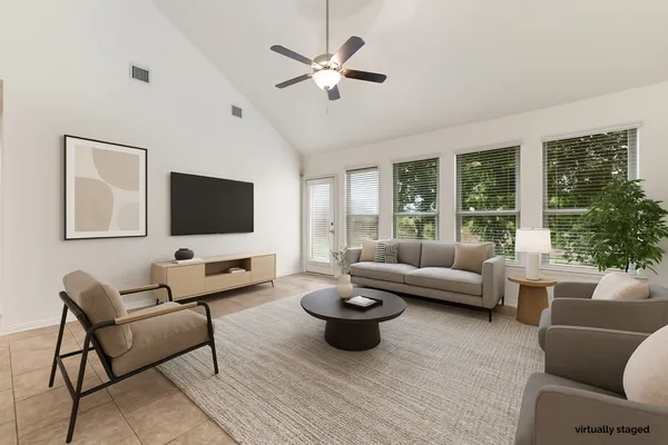 a living room with furniture and a flat screen tv