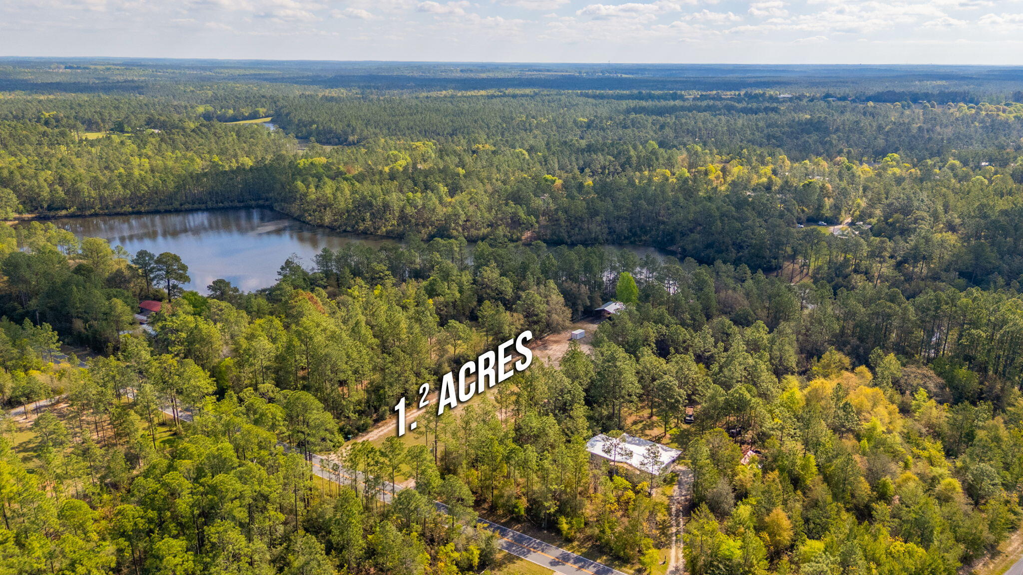 68 Beaver Dam Road DeFuniak Springs, FL 32433 - Photo 2 of 10 a view of a lake with mountains in the background