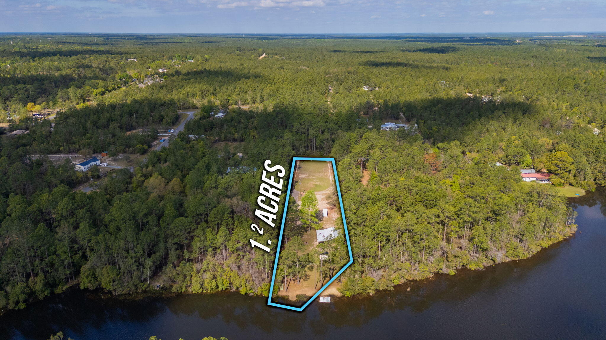 68 Beaver Dam Road DeFuniak Springs, FL 32433 - Photo 7 of 10 a view of lake with city
