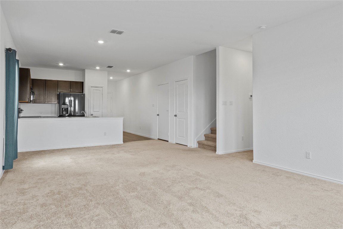 600 The Ugly Way Jarrell, TX 76537 - Photo 22 of 33 a view of a kitchen with a sink and a refrigerator