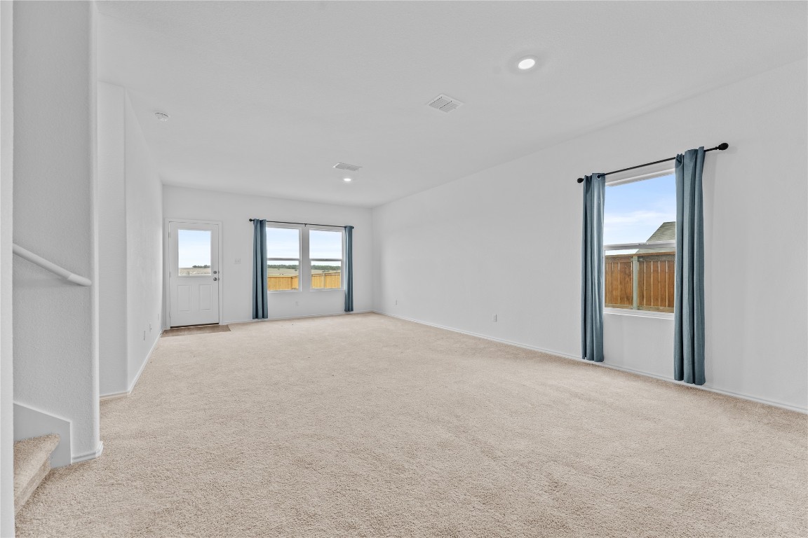 600 The Ugly Way Jarrell, TX 76537 - Photo 3 of 33 a view of an empty room with window and cabinet
