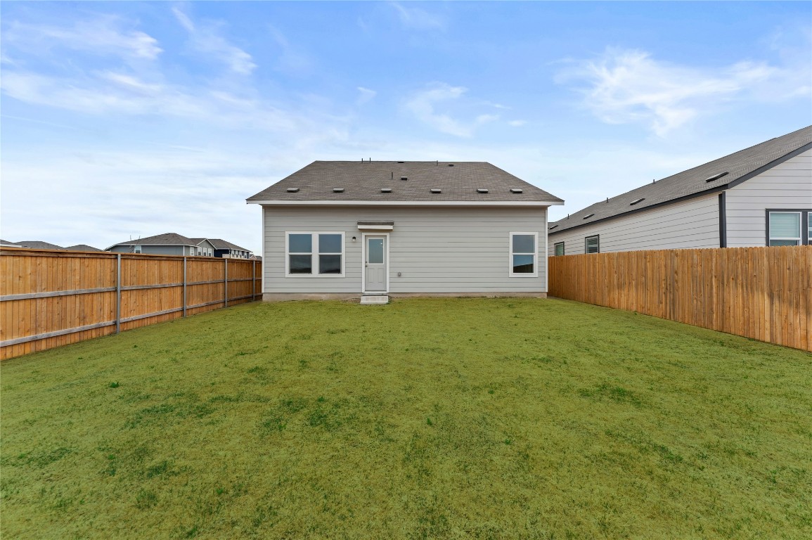 600 The Ugly Way Jarrell, TX 76537 - Photo 31 of 33 a view of a house with a backyard