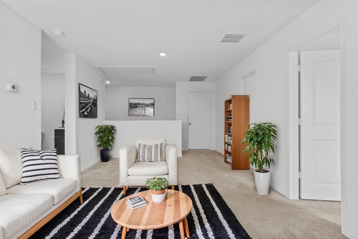 600 The Ugly Way Jarrell, TX 76537 - Photo 8 of 33 a living room with furniture and a potted plant