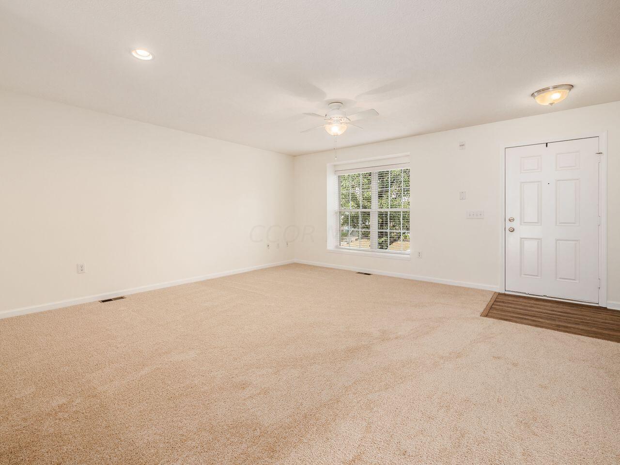 6305 Needletail Road, Unit 25 Columbus, OH 43230 - Photo 14 of 49 Living room, front entry.