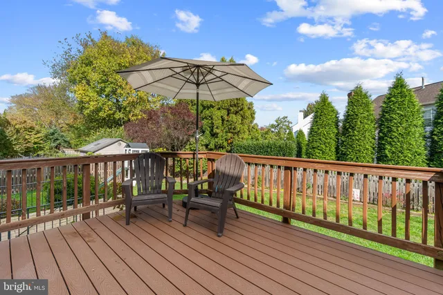 a view of balcony with furniture and wooden floor