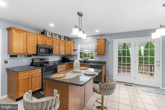 a kitchen with a sink stove and refrigerator