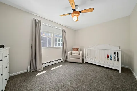 a bed room with furniture and a window