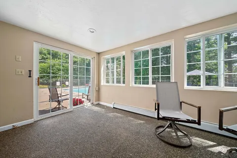 a room with gym equipment and floor to ceiling window