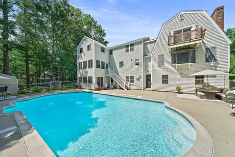 an aerial view of a house with swimming pool