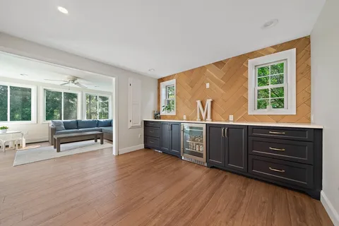 a living room with furniture and windows