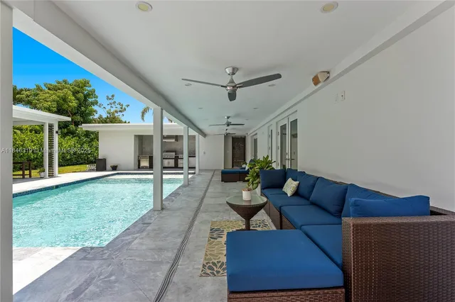 a kitchen with stainless steel appliances granite countertop a sink and a stove