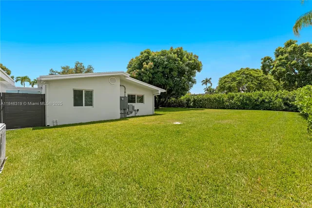 a kitchen with a sink cabinets and stainless steel appliances
