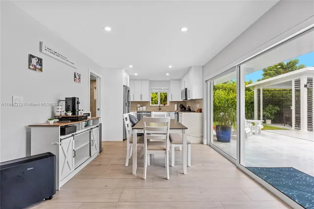 a view of a hallway with washer and dryer