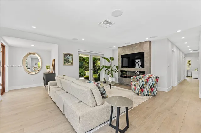 a living room with fireplace furniture and a flat screen tv