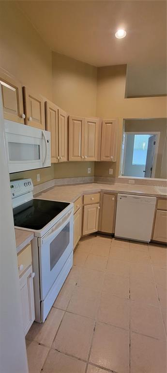 10050 Southwest 52nd Road Gainesville, FL 32608 - Photo 13 of 39 a kitchen that has a sink and a stove in it