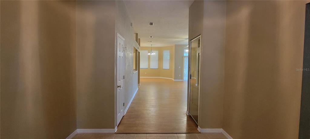 10050 Southwest 52nd Road Gainesville, FL 32608 - Photo 14 of 39 a view of a hallway with wooden floor