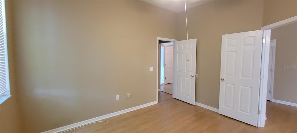 10050 Southwest 52nd Road Gainesville, FL 32608 - Photo 17 of 39 a view of a room with wooden floor
