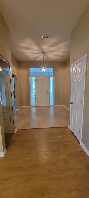 10050 Southwest 52nd Road Gainesville, FL 32608 - Photo 18 of 39 a view of a hallway with wooden floor