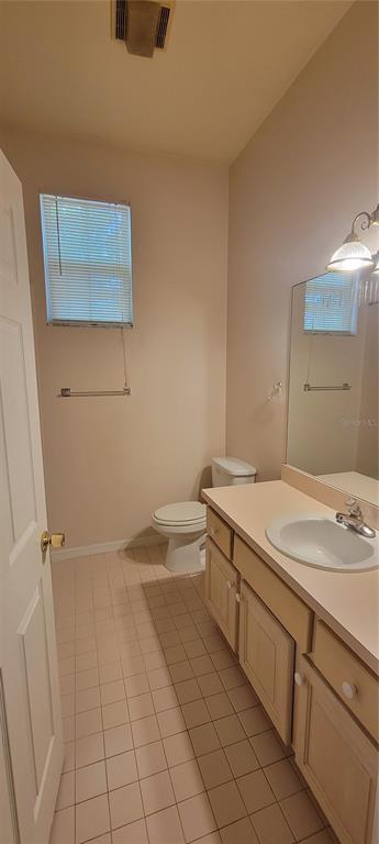 10050 Southwest 52nd Road Gainesville, FL 32608 - Photo 21 of 39 a bathroom with a granite countertop sink and a mirror