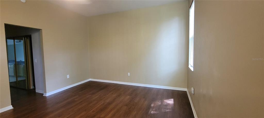 10050 Southwest 52nd Road Gainesville, FL 32608 - Photo 25 of 39 wooden floor in an empty room