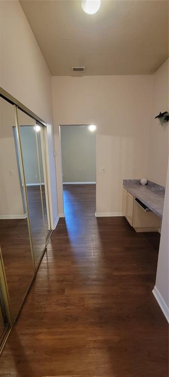 10050 Southwest 52nd Road Gainesville, FL 32608 - Photo 26 of 39 a view of hallway with stairs and wooden floor