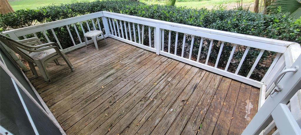 10050 Southwest 52nd Road Gainesville, FL 32608 - Photo 35 of 39 a view of balcony with wooden floor