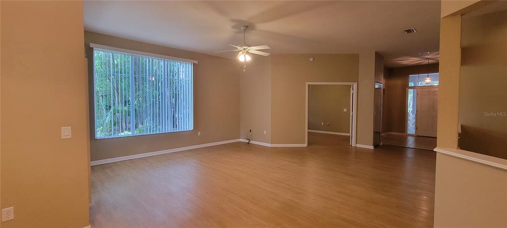 10050 Southwest 52nd Road Gainesville, FL 32608 - Photo 4 of 39 an empty room with closet and windows