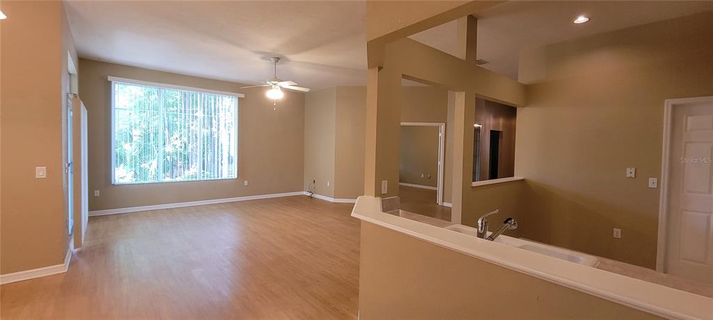 10050 Southwest 52nd Road Gainesville, FL 32608 - Photo 6 of 39 a view of an empty room with window and bathroom