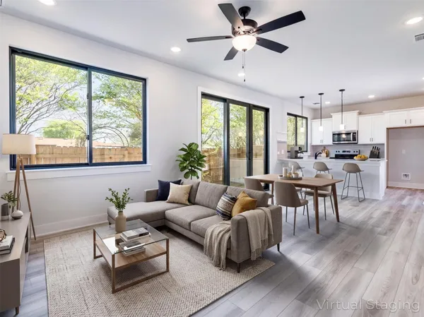 a living room with furniture and a large window