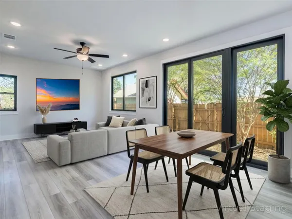 a view of a dining room with furniture window and outside view