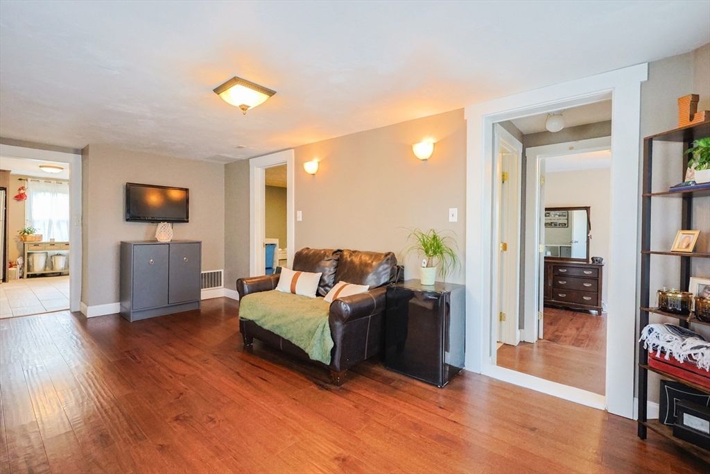22 Rock Street Acushnet, MA 02743 - Photo 16 of 41 a living room with furniture and a wooden floor