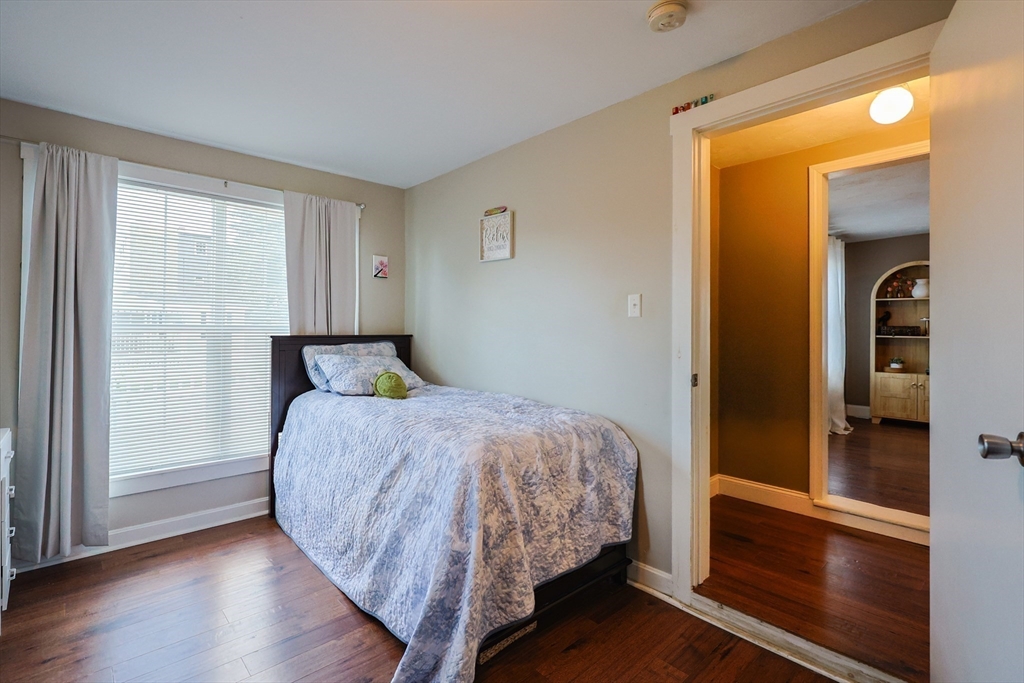 22 Rock Street Acushnet, MA 02743 - Photo 19 of 41 a bedroom with a bed and wooden floor