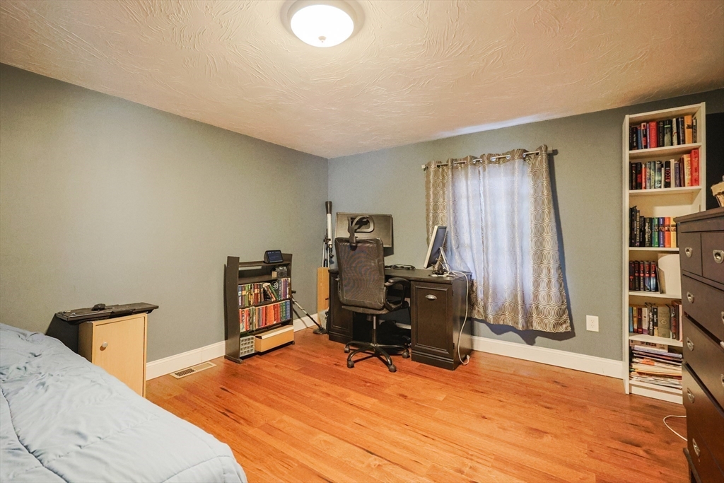 22 Rock Street Acushnet, MA 02743 - Photo 21 of 41 a room with furniture and a wooden floor